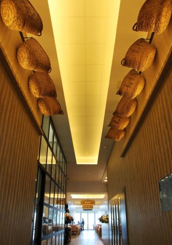a hallway with wicker baskets on the ceiling of a building at Hotel Boutique Balandret in Valencia