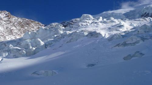a large snow covered mountain with snow covered rocks at Apartment Theresli First Floor in Saas-Almagell