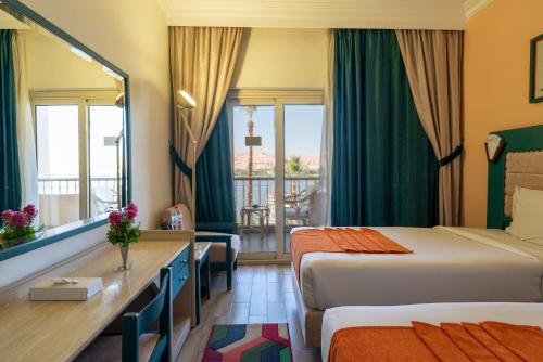 Postel nebo postele na pokoji v ubytování Aracan Eatabe Luxor Hotel
