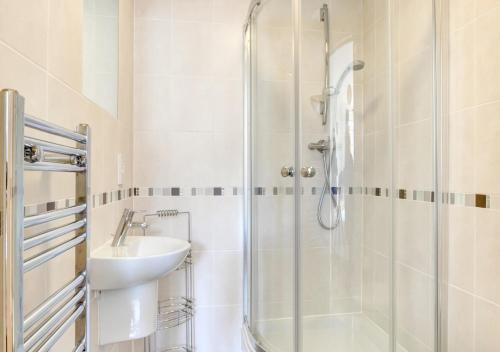 a bathroom with a shower and a sink at Flat 8 Broadleys in Swanage