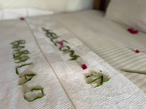 a close up of the writing on a bed at Babalao Bungalows in Nungwi