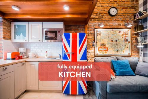 a tiny kitchen with a sign that says fully equipped kitchen at Revelton Studios Karlovy Vary in Karlovy Vary