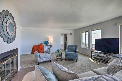 a living room with a fireplace and a tv at Pet-Friendly Cayucos Home with Ocean Views! in Cayucos