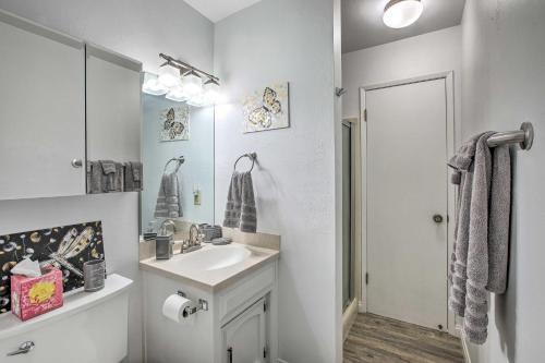 a white bathroom with a sink and a mirror at Pet-Friendly Cayucos Home with Ocean Views! in Cayucos