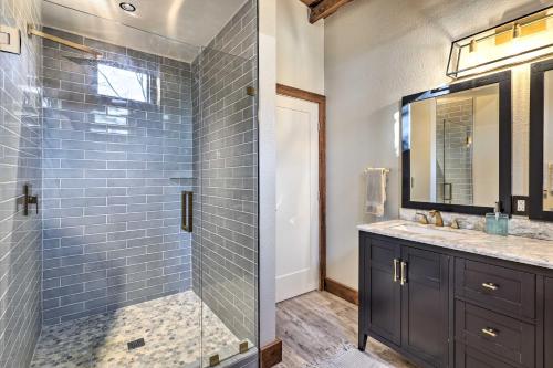a bathroom with a shower with a glass door at Renovated Fort White Retreat with River Access! in Fort White