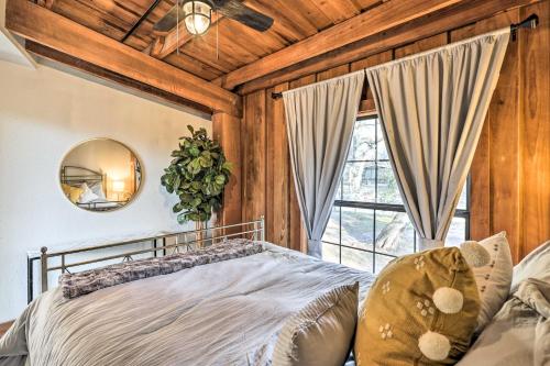 a bedroom with a bed and a large window at Fort White Retreat Deck and River Access! in Fort White