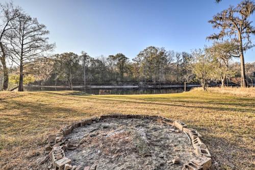 a circle in the middle of a field next to a pond at Fort White Retreat Deck and River Access! in Fort White