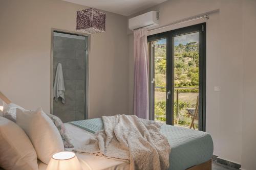 a bedroom with a bed and a window with a view at Queen Bee Residence in Minia