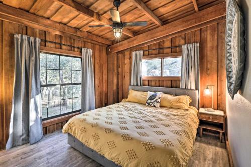 a bedroom with a bed and a ceiling fan at Renovated Fort White Retreat with River Access! in Fort White