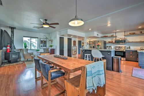 a kitchen and living room with a wooden table and chairs at Pet-Friendly Gem with Treehouse 20 Mi to Sedona in Cottonwood