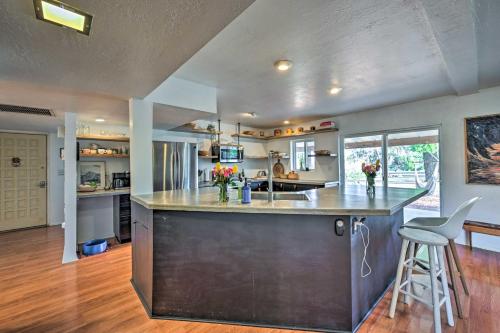 a kitchen with a large island in the middle of a room at Pet-Friendly Gem with Treehouse 20 Mi to Sedona in Cottonwood