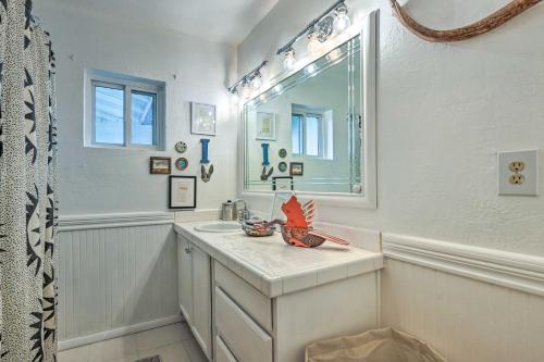 a white bathroom with a sink and a mirror at Pet-Friendly Gem with Treehouse 20 Mi to Sedona in Cottonwood