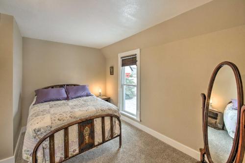 a bedroom with a bed and a mirror at Charming Stevensville Home with Open Yard! in Stevensville