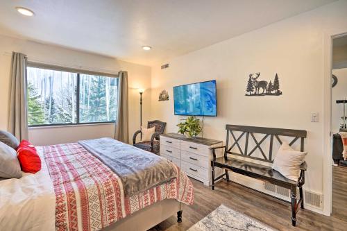 a bedroom with a bed and a dresser and a window at Serene Condo Near Park City Resort! in Park City