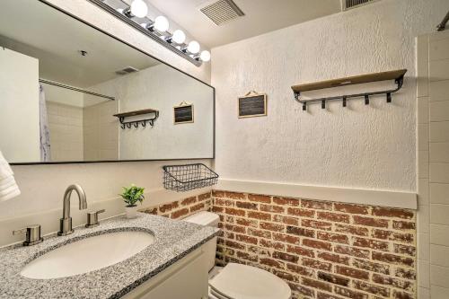 a bathroom with a sink and a toilet and a mirror at Serene Condo Near Park City Resort! in Park City