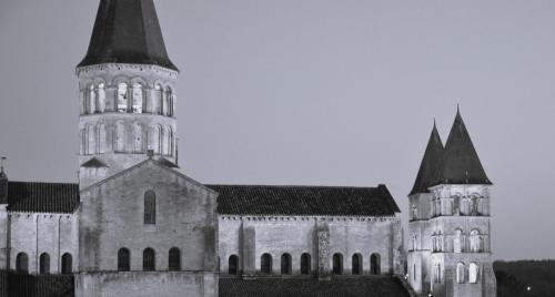 a black and white photo of a building with a tower at Hôtel Le Prieuré in Paray-le-Monial