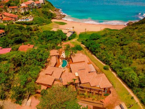 an aerial view of a house on the beach at Buzios Espiritualidade Hotel in Búzios