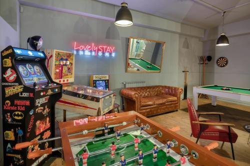 a room with a ping pong table and a pool table at Bloom Hotel Rome in Rome