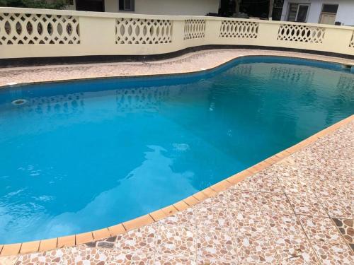 a swimming pool in a house with blue water at Two bedroom Apartment in Oyster Bay in Dar es Salaam