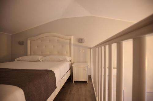 a bedroom with a large bed and a window at B&B Royal in Sellia Marina