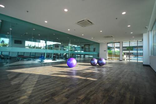 an office with three purple balls on the floor at The Light Hotel Penang in Perai