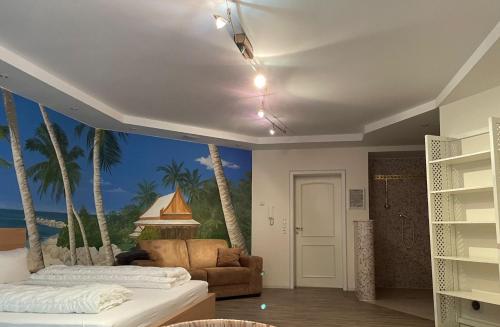 a bedroom with a mural of palm trees at Villa Am Park in Bad Homburg vor der Höhe