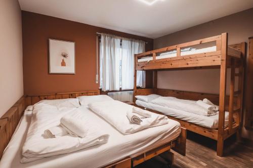 Postel nebo postele na pokoji v ubytování Residence Montani