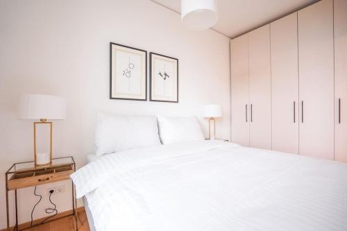 Ένα ή περισσότερα κρεβάτια σε δωμάτιο στο Executive Suite w/ Rooftop Pool
