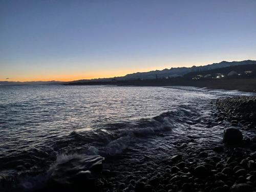 a view of a body of water at sunset at Ak-Tengir Yurt Resort in Tossor