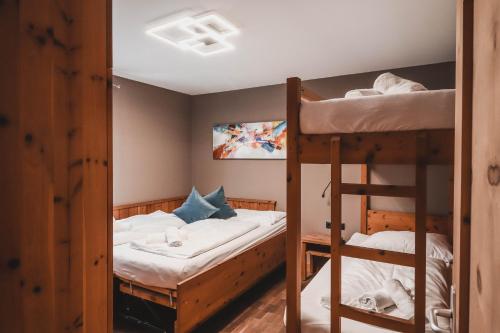 Postel nebo postele na pokoji v ubytování Residence Montani