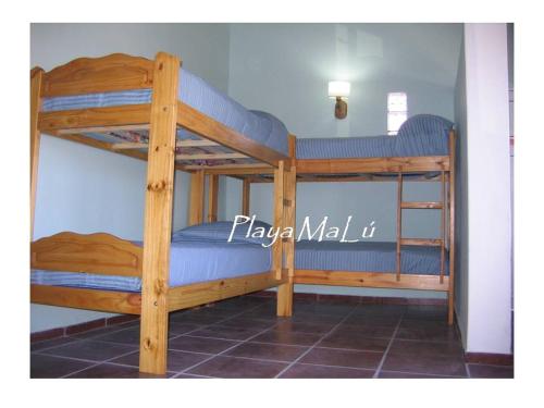 a couple of bunk beds in a room at Playa MaLú in Las Toninas