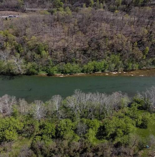 an aerial view of a river with trees and a forest at Cozy Cabin w/ Indoor Fireplace & Tranquil views in Luray