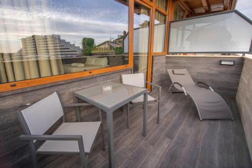 a room with a table and chairs and a window at Virtus Prestige - Rooms & Apartments in Rome