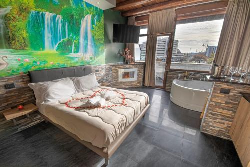 a bedroom with a bed and a bath tub and a bathroom at Virtus Prestige - Rooms & Apartments in Rome
