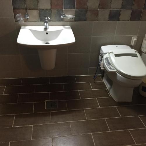 a bathroom with a sink and a toilet at 레전드호텔 in Daejeon