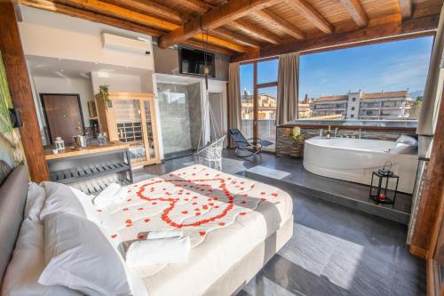 a bathroom with a large bed and a bath tub at Virtus Prestige - Rooms & Apartments in Rome