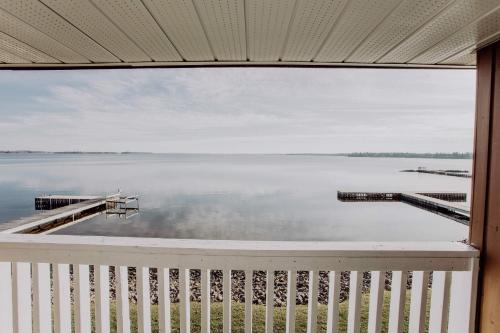 a view of the water from a house balcony at La Place Rendez-Vous Hotel in Fort Frances
