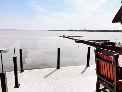 a view of a body of water with a dock at La Place Rendez-Vous Hotel in Fort Frances