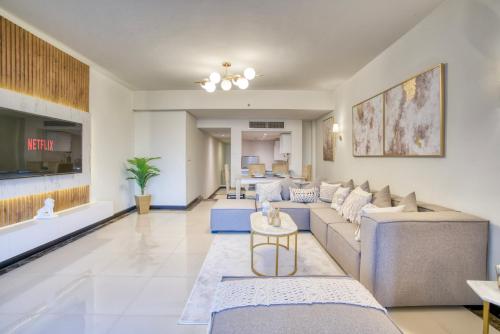 a living room with a couch and a table at LOFTS by Elegant Hospitality in Cairo