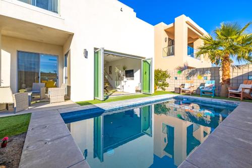 a house with a swimming pool in front of a house at Gateway Luxury Resort Style With A Private Pool in Palm Springs