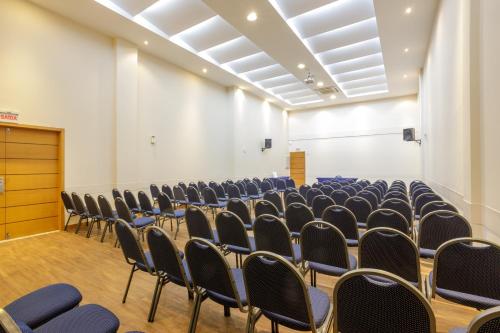 an empty room with rows of chairs in it at Interclass Florianópolis in Florianópolis