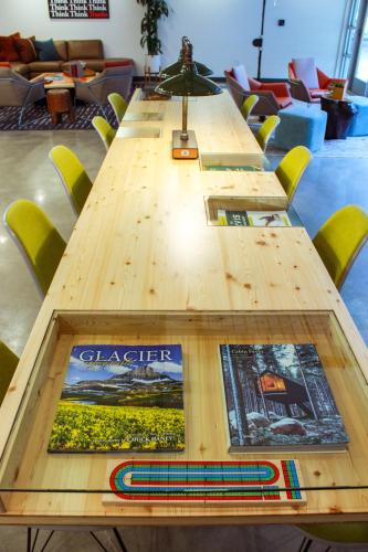 a long wooden table in a room with chairs at The Wren in Missoula