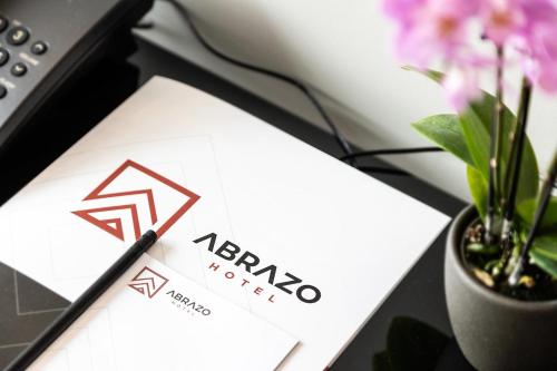 a pen sitting on top of a paper on a desk at Abrazo Sofia Hotel by HMG in Sofia