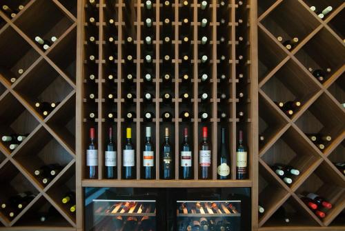 a wall of wine bottles in a wine cellar at H41 Luxury Suites in Belgrade