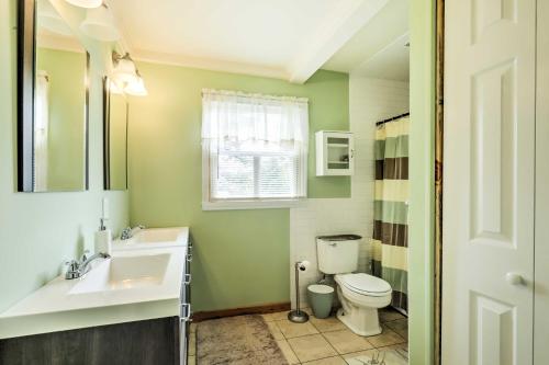 a bathroom with a sink and a toilet at North Creek Cottage in the Adirondacks with Fire Pit in North Creek