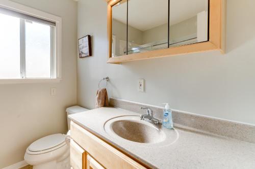 a bathroom with a sink and a toilet at 5 Bedroom Charmer with Pool in Reseda