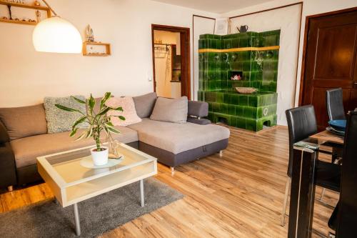 a living room with a couch and a table at Apartments am See in Brienz