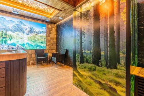 a conference room with a mural of a forest at Rezydencja Markowy Dworek in Białka Tatrzanska