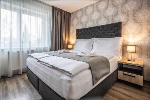 Posteľ alebo postele v izbe v ubytovaní Hotel Demanova Apartments - Dependance