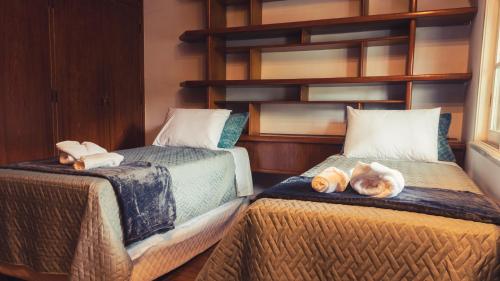 Un pat sau paturi într-o cameră la Hostel Urbanature
